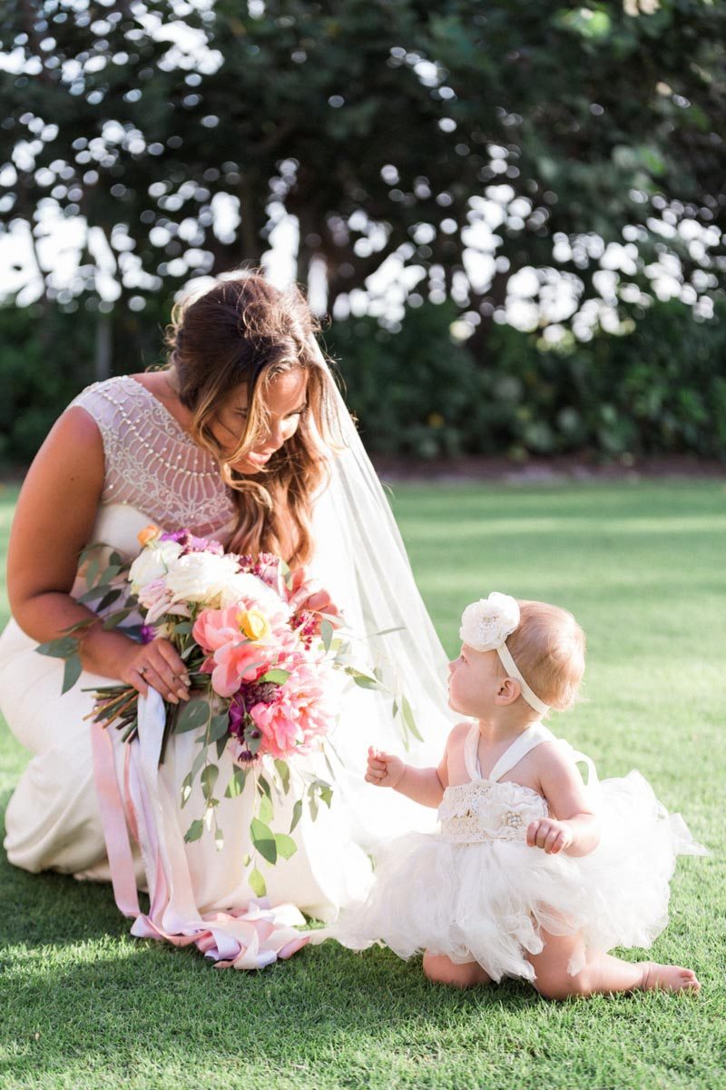 Flower girl headband tutu bride bent over  Mirtich_Scordos_Hunter_Ryan_Photo_sanibelislandcasaybelweddingphotographyhunterryanphoto8640  - Atlanta Style Weddings