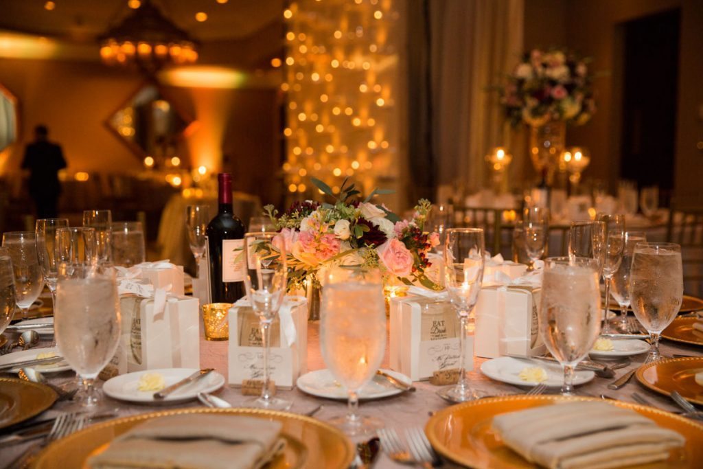 Table details and light background water filled glasses and gold plates with white napkins 11-14-15 Tara and Justin 70