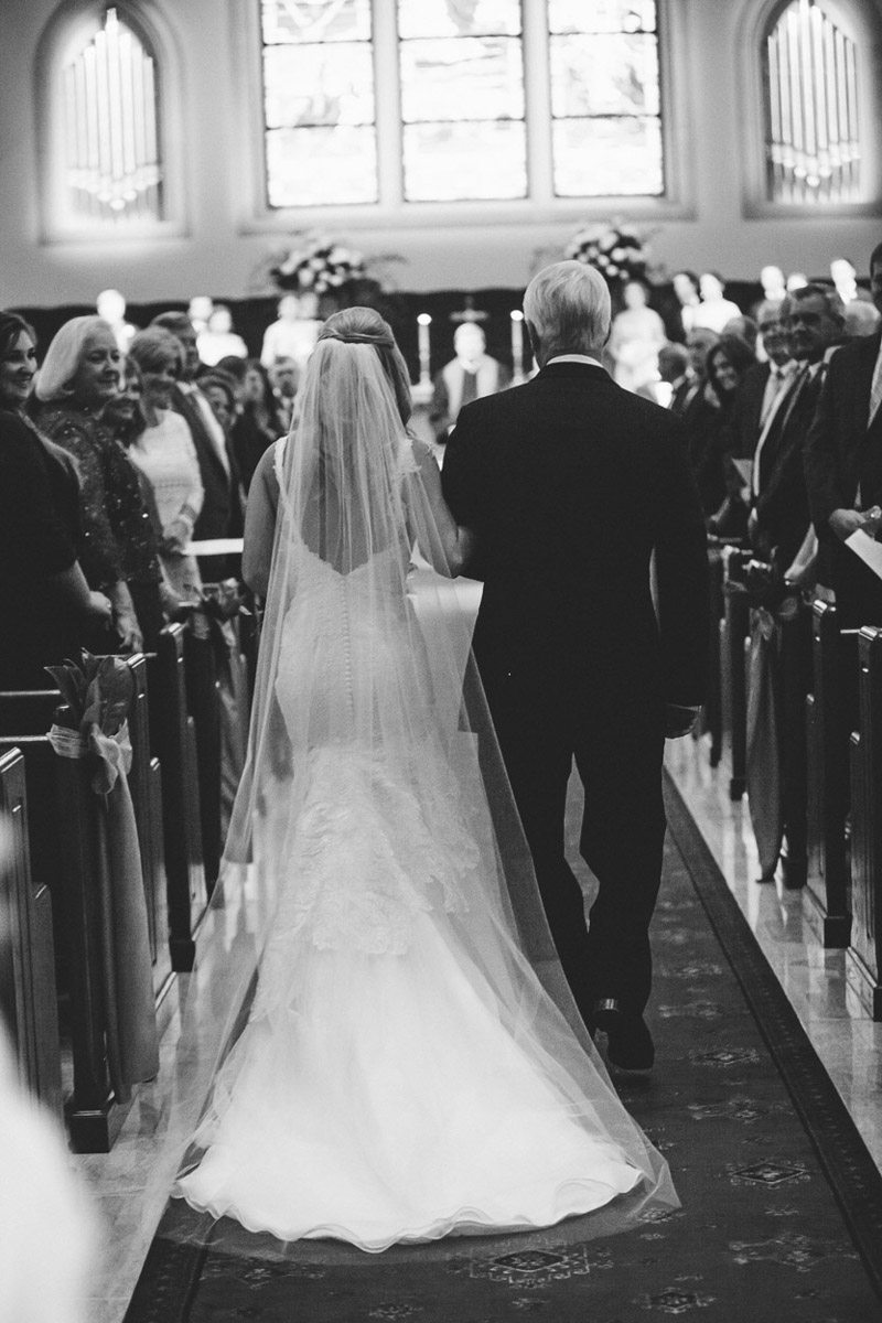 Bride and father walking down the aisle