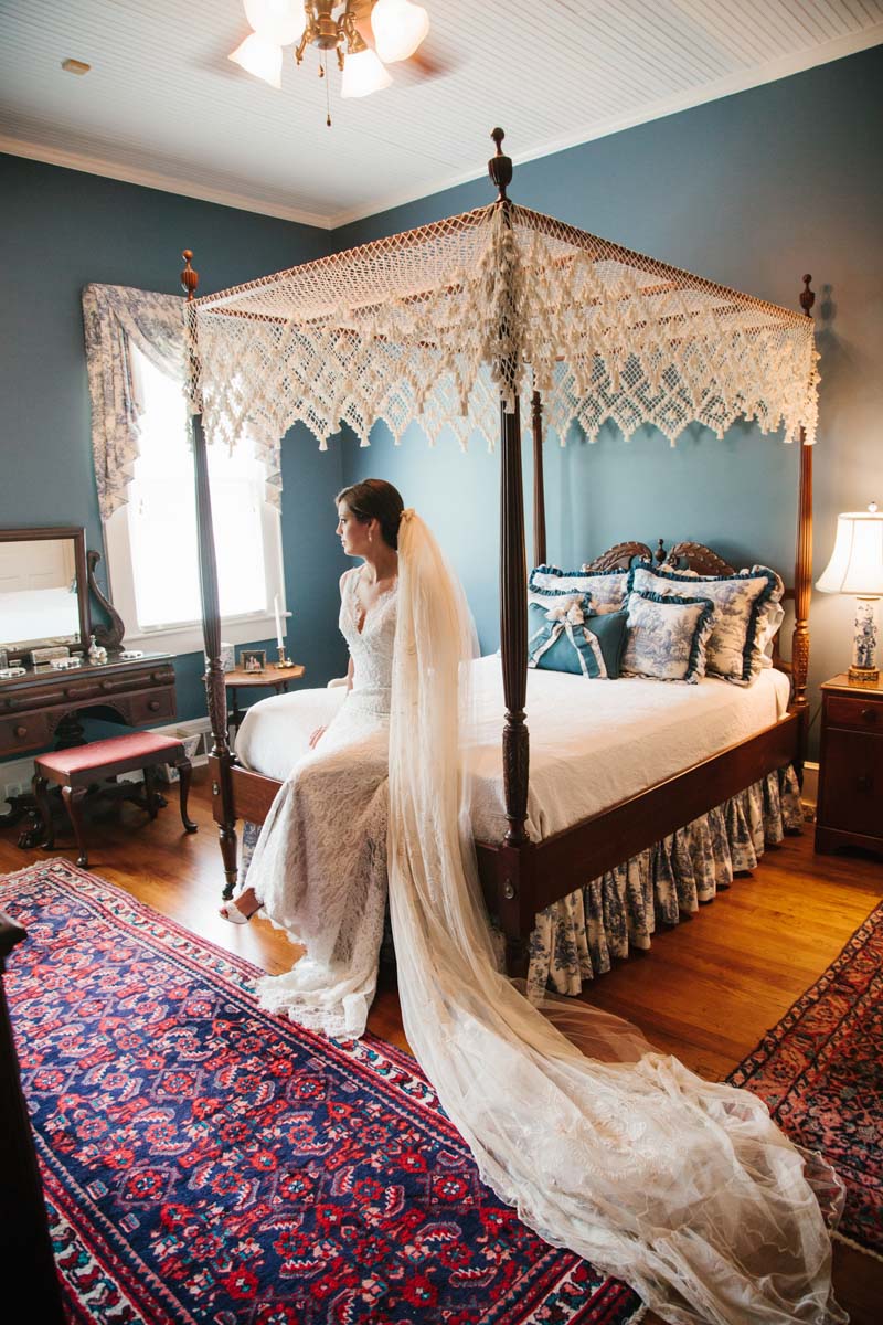 Bride in dress on bed