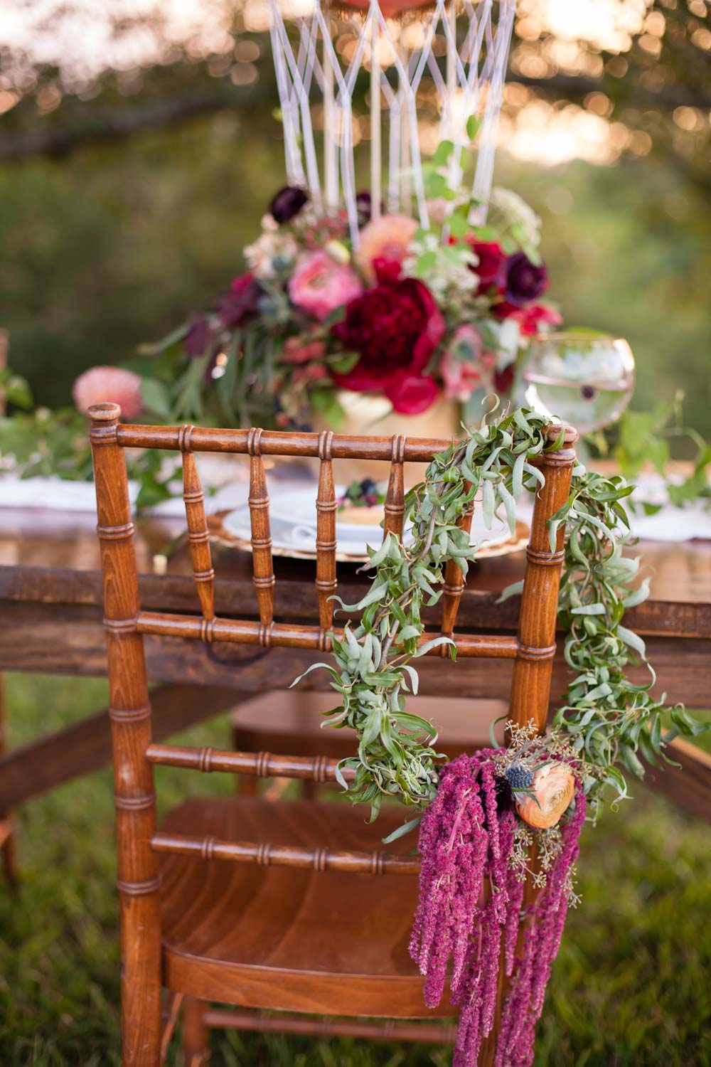 greenery-on-reception-chairs-chey-photography-sweet-meadow-103