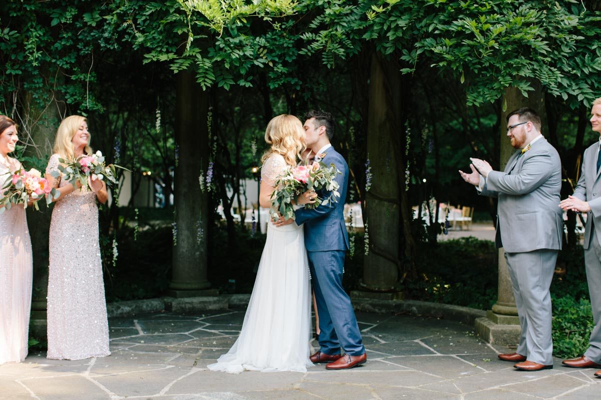 outdoor-wedding-cator-woolford-gardens-first-kiss